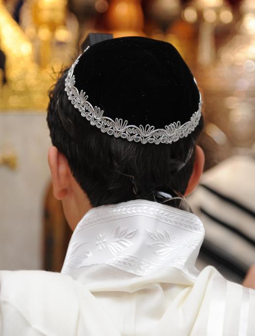 A Jewish boy celebrates his bar mitzvah at the age of 13.