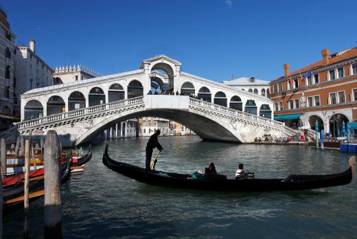 Gondolas and water taxis are used to transport people in Venice.