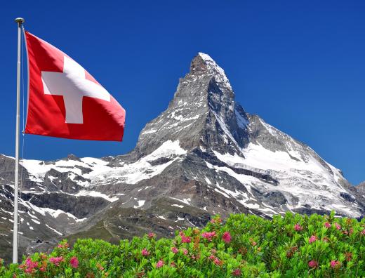 The Swiss flag with the Matterhorn in the background.